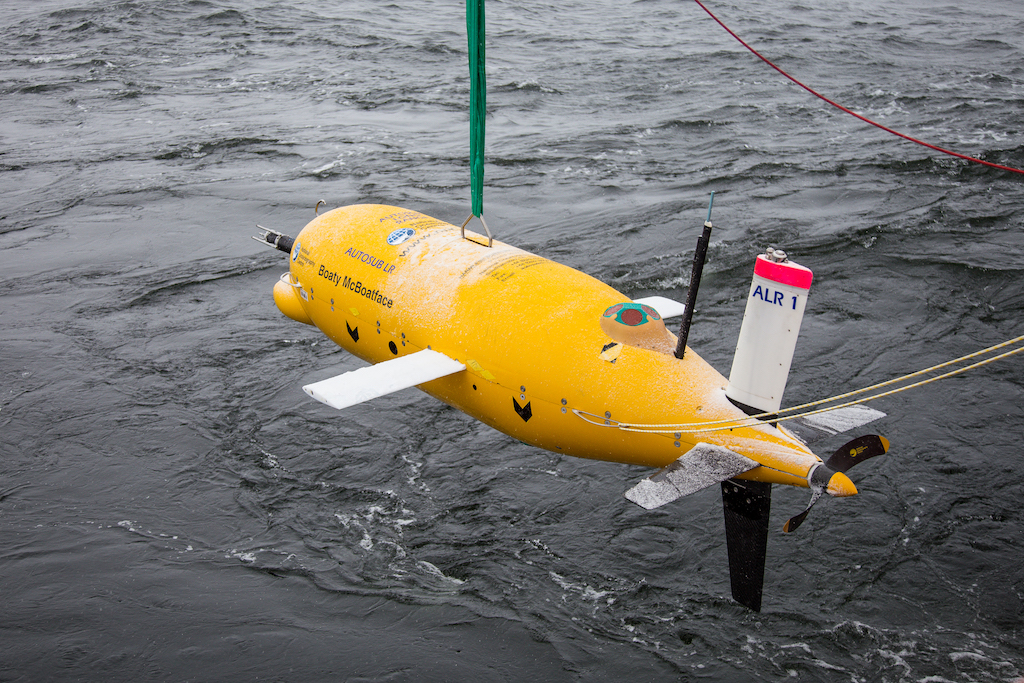 The autonomous underwater vehicle Boaty McBoatface suspended over the water