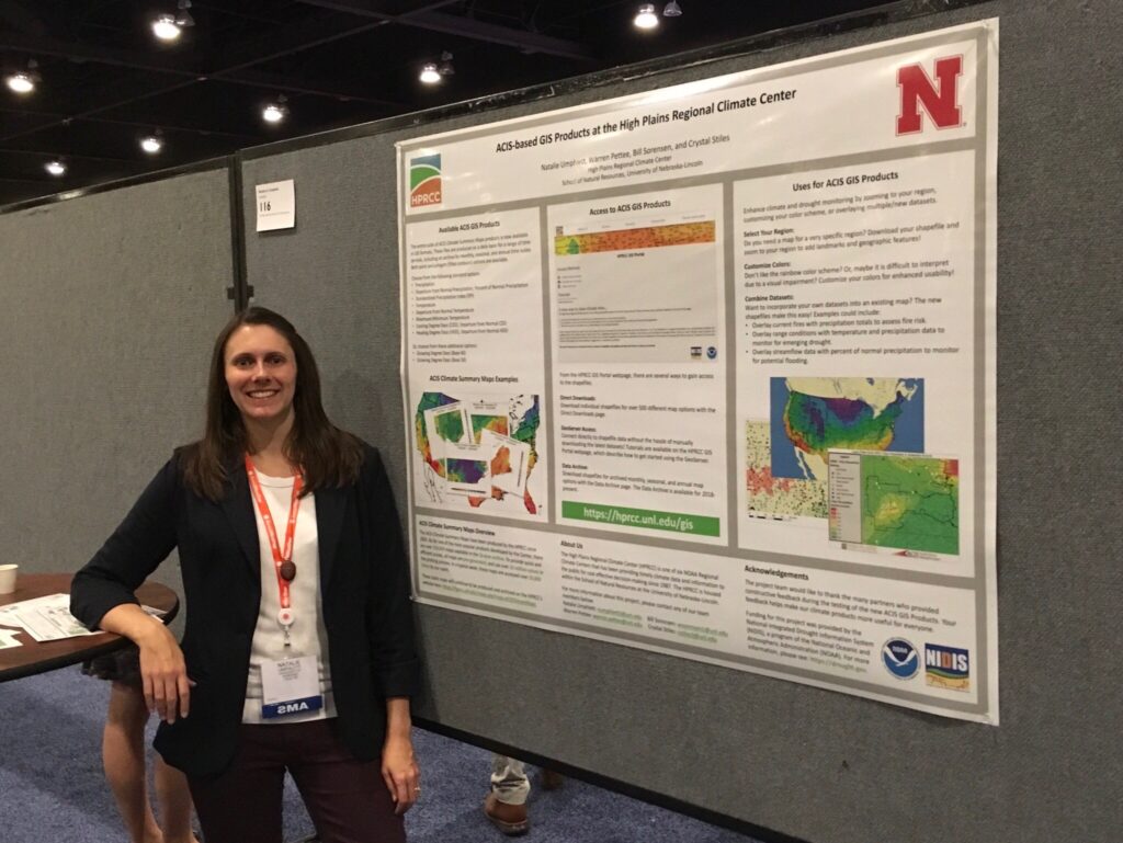 Natalie Umphlett standing in front of her poster at the 99th AMS Annual Meeting.