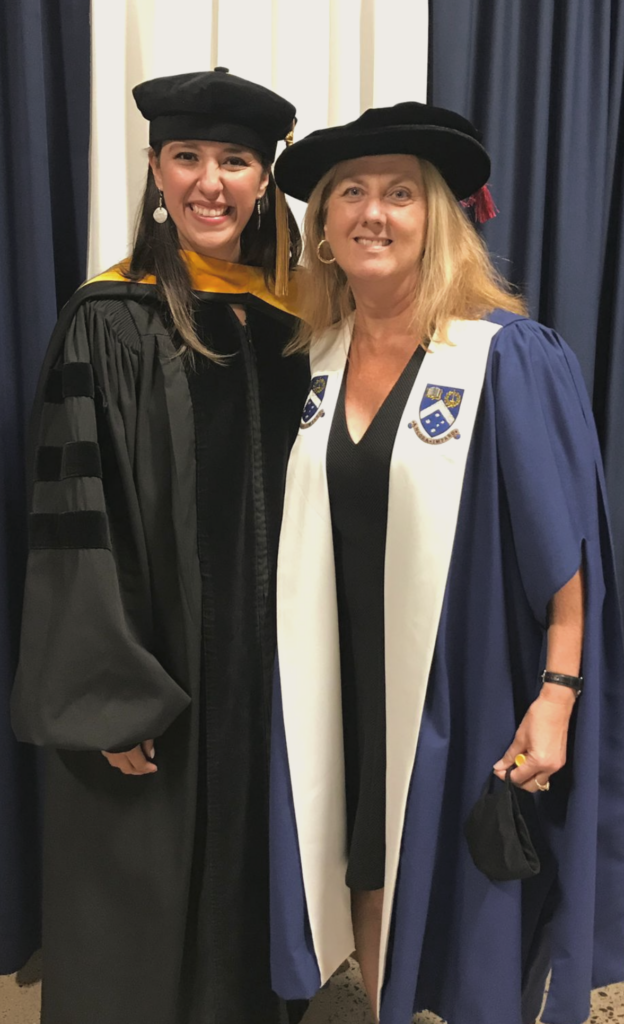 A photo showing Kelly M. Núñez Ocasio with her advisor, Jenni Evans, at Kelly’s PhD graduation from Penn State in 2021.