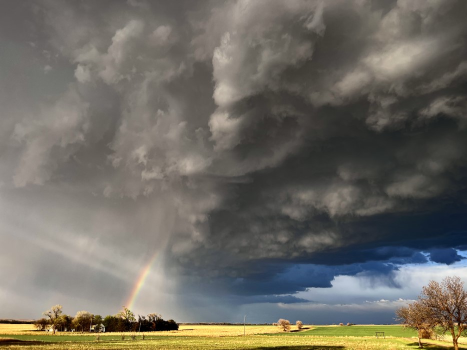 Intense thunderstorm and rainbow captured from a backyard in Lincoln, Kansas