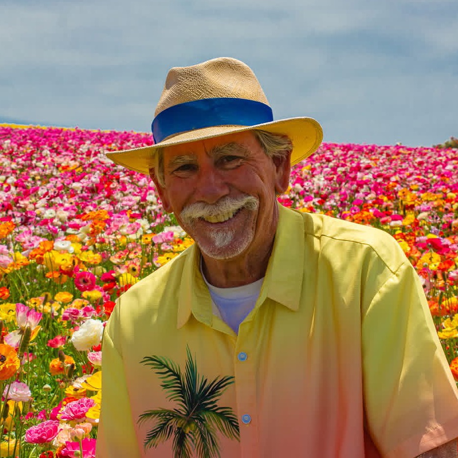 Jim Grant in front of a field of tulips. Photo courtesy of Jim Grant.