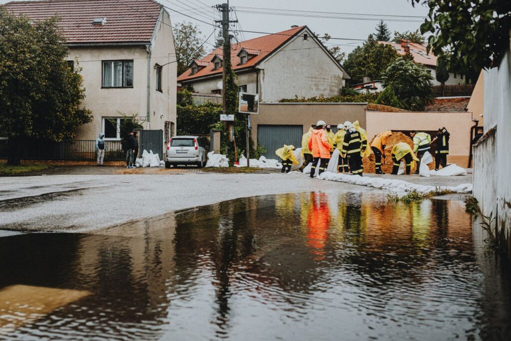 Flooded street with emergency responders