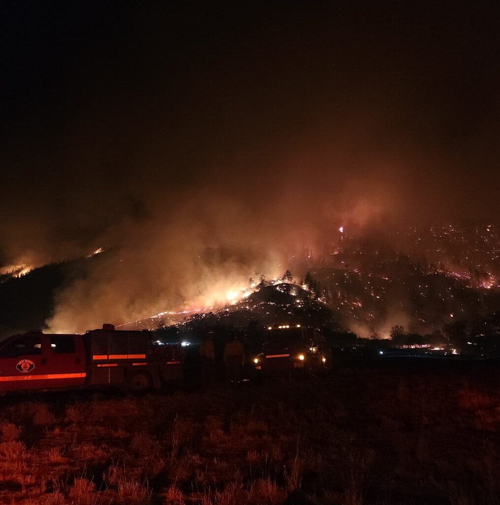 Fire on a hillside at night.