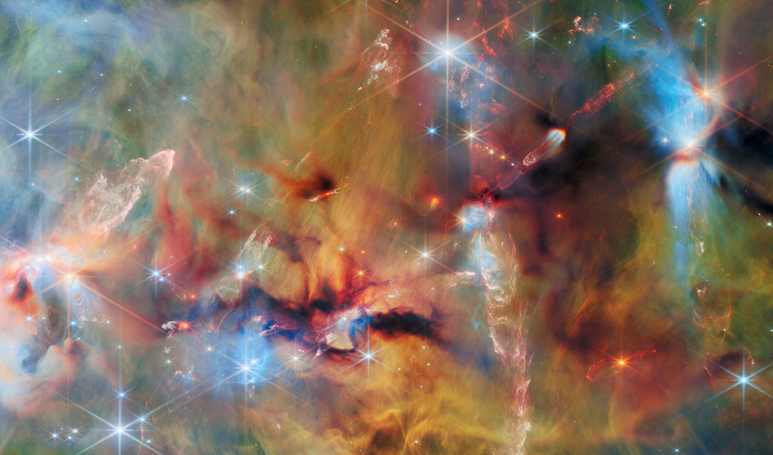 Beyond the Orion Nebula is a long and massive filament of cold gas and dust, divided into four parts and collectively called the Orion Molecular Clouds. This image, captured by Webb shows just a small portion of one of the clouds.